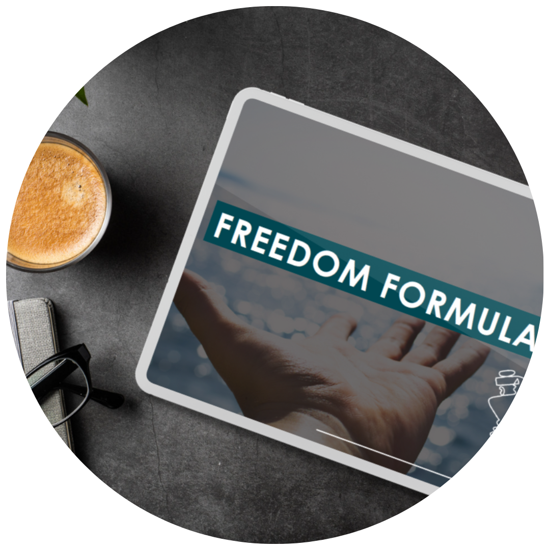 Billion Dollar Broker Freedom Formula mockup on a tablet, on a black desk next to a cup of coffee